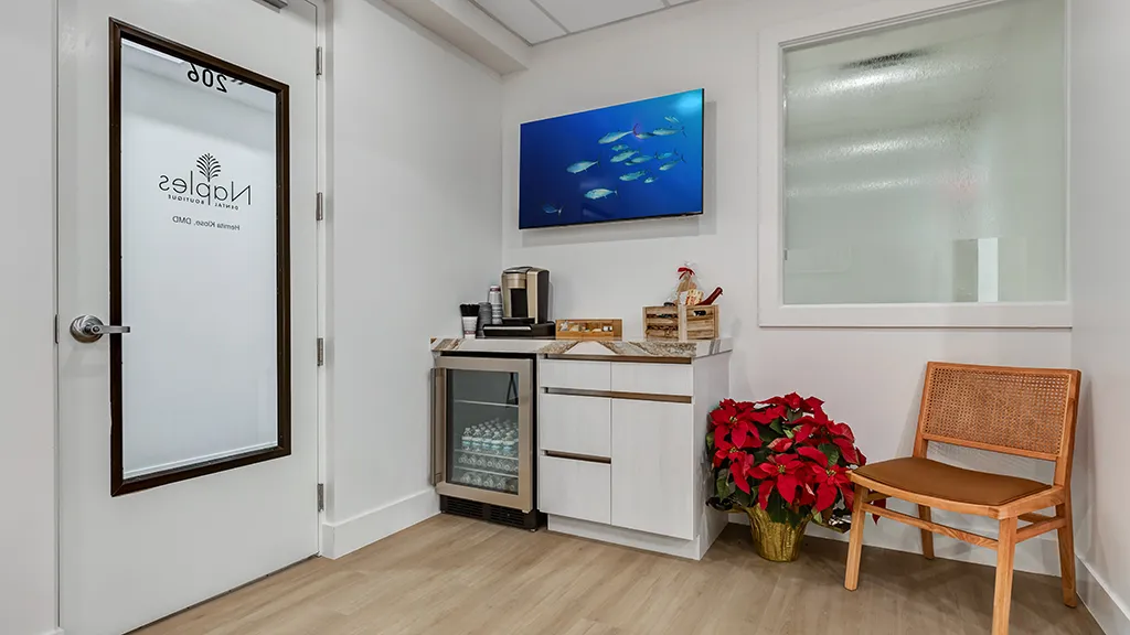 Refreshment station and seating area at naples dental boutique in naples, fl.
