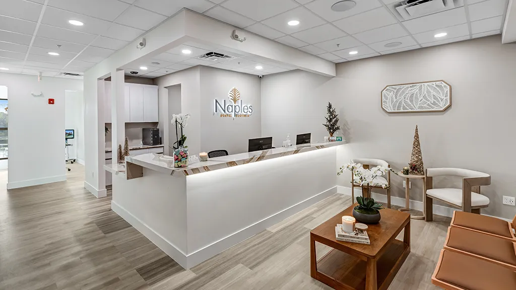 Welcoming reception area at naples dental boutique featuring modern design and calming décor.