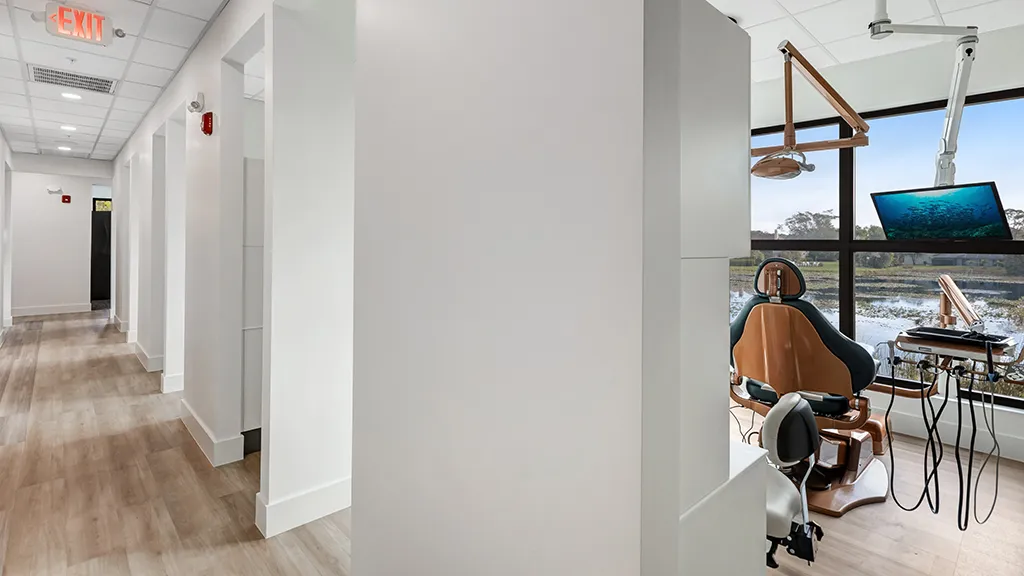 Bright dental operatory with lake view and modern equipment at naples dental boutique.