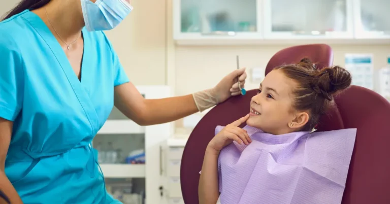 Pediatric Dentistry in Naples - Child smiling during dental checkup at Naples Dental Boutique
